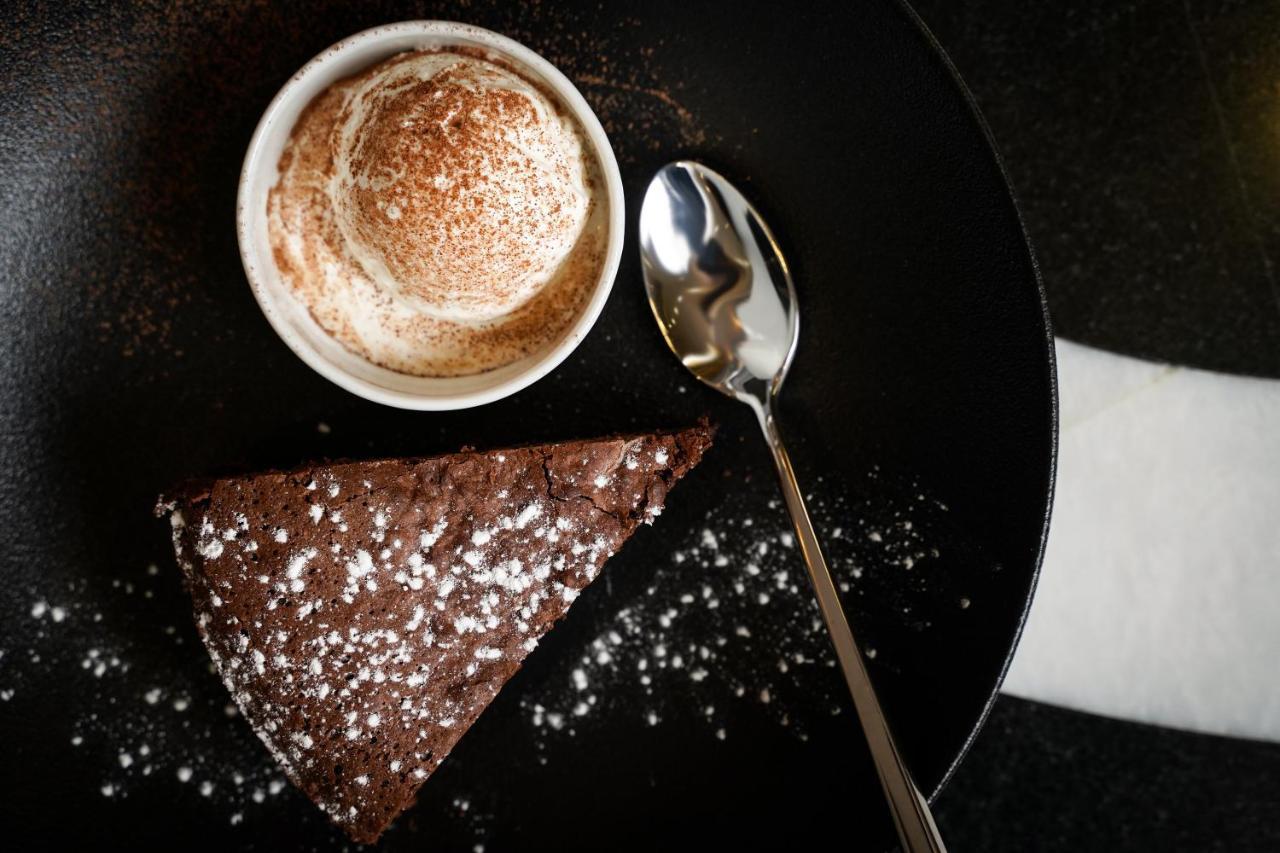 Ambiance Boutique Art Hotel Lahore Esterno foto A chocolate cake with a cup of coffee